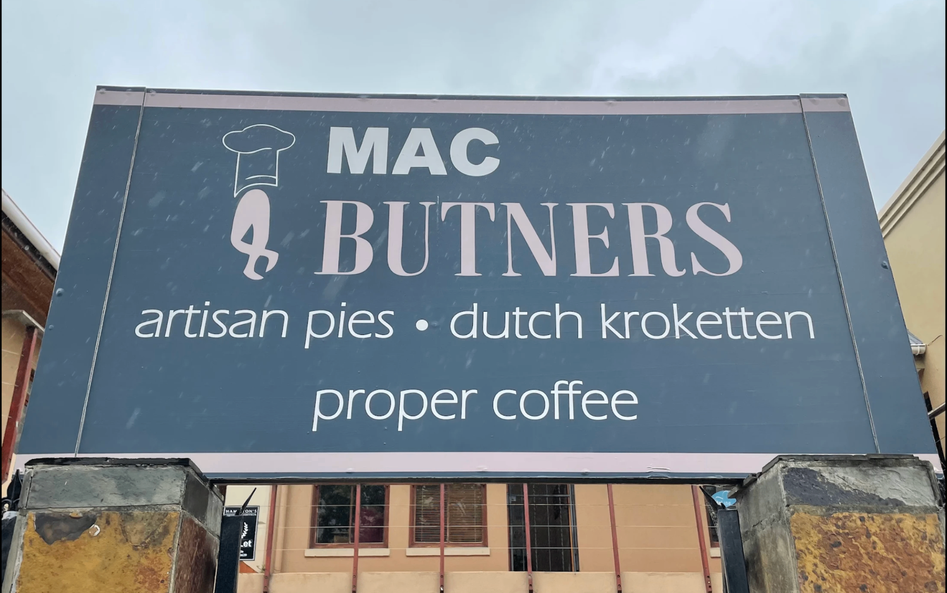 Mac Butners sign advertising artisan pies, Dutch kroketten and proper coffee