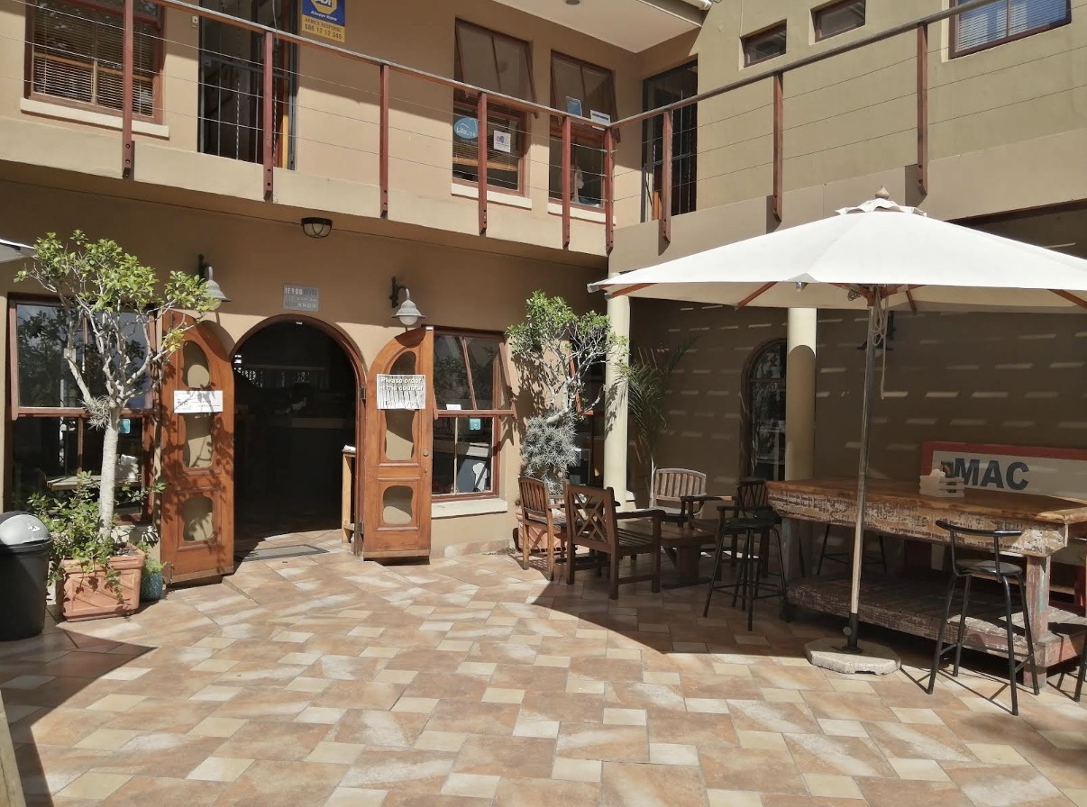 Sunny courtyard seating at Mac Butners in Sedgefield