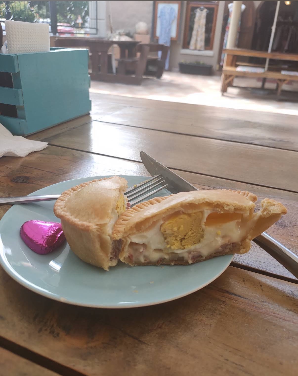 Breakfast pie cut open showing egg, bacon and cheese